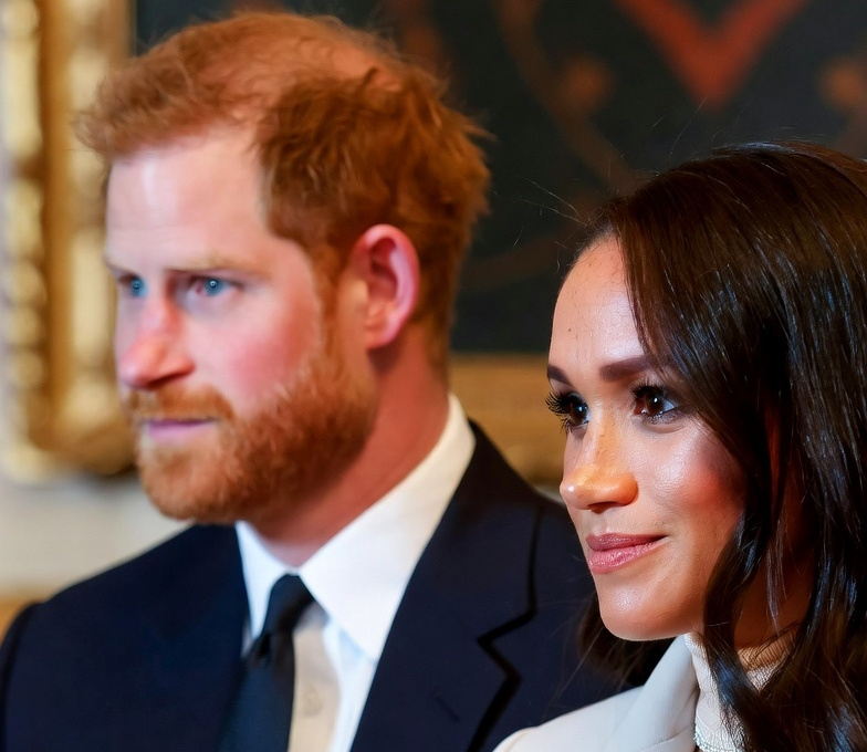 Prince Harry Looks Very Uneasy Next To ‘Relaxed’ Meghan Markle